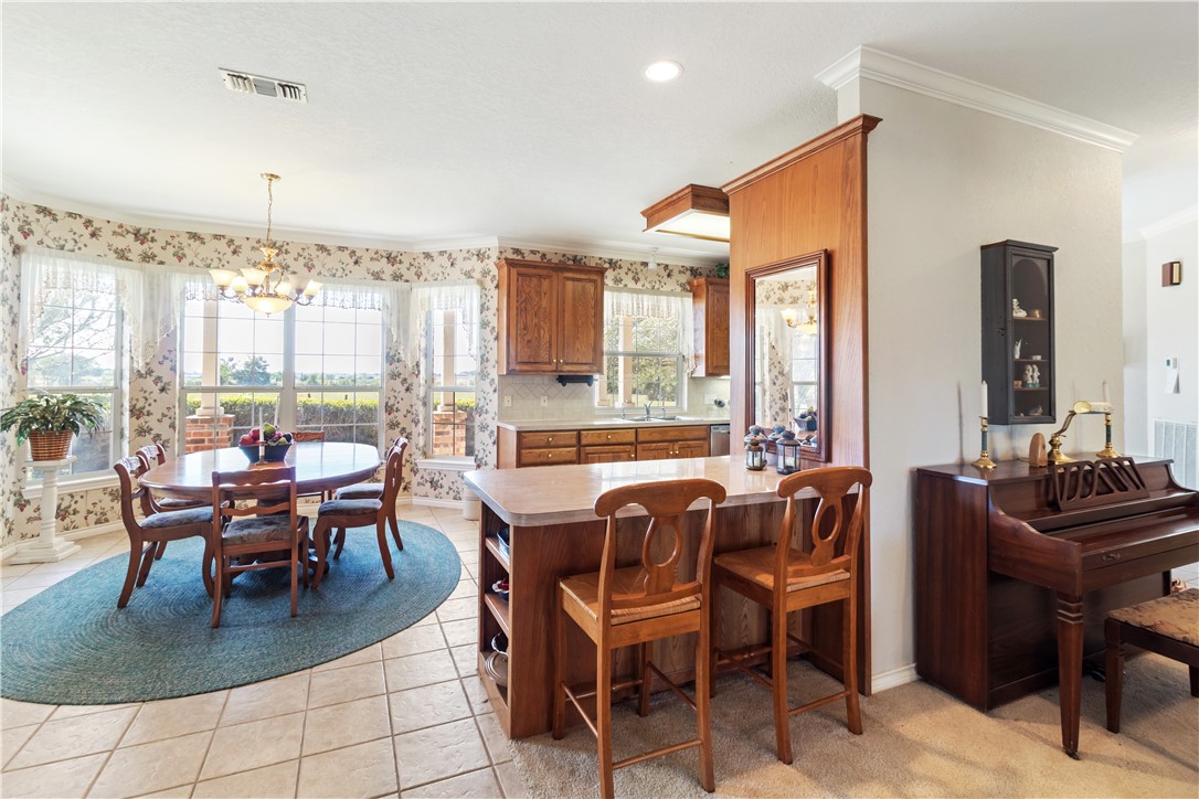 28109 Waller Gladish Road Waller, TX 77484 - Photo 24 of 28 a dining room with furniture and large windows