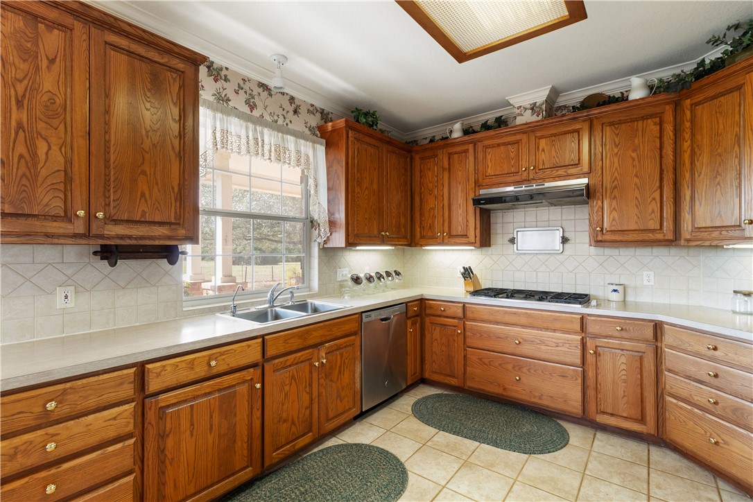 28109 Waller Gladish Road Waller, TX 77484 - Photo 26 of 28 a kitchen with sink cabinets and window
