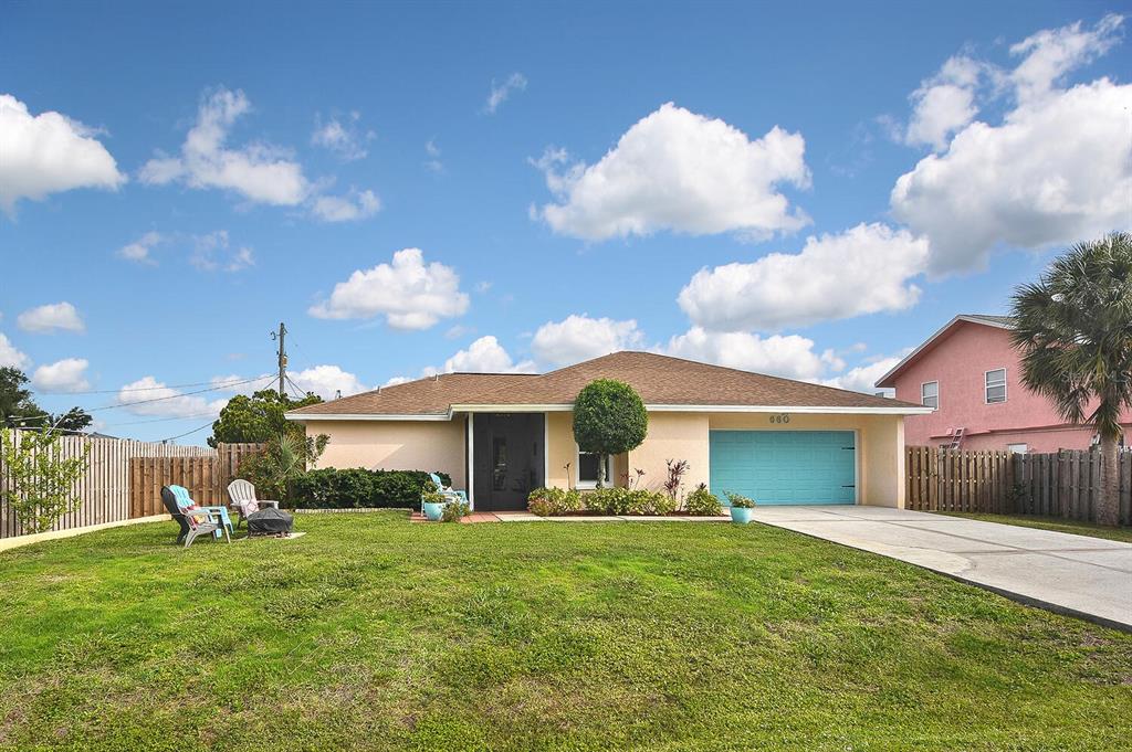 660 Cabana Road Venice, FL 34293 - Photo 1 of 1 a front view of a house with garden