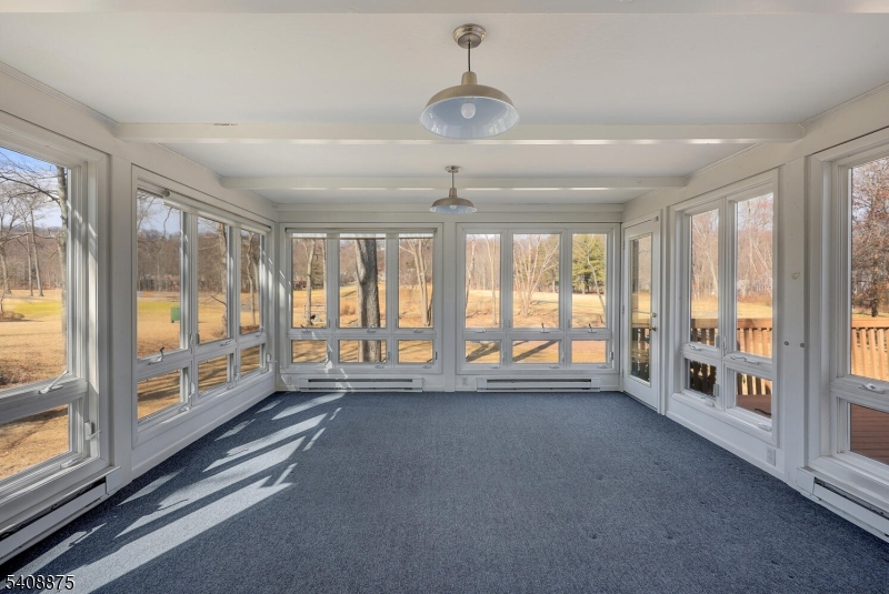 49 Overlook Road Morristown, NJ 07960 - Photo 11 of 28 a view of an empty room with windows