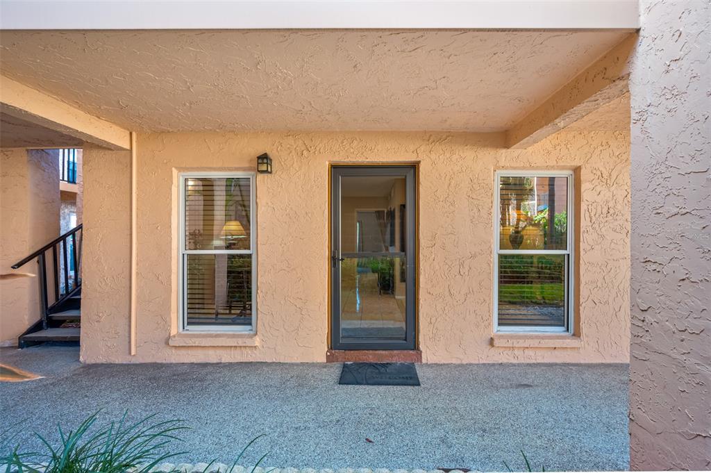 8921 Blind Pass Road, Unit 134 St. Pete Beach, FL 33706 - Photo 1 of 1 Front door of this ground floor unit.
