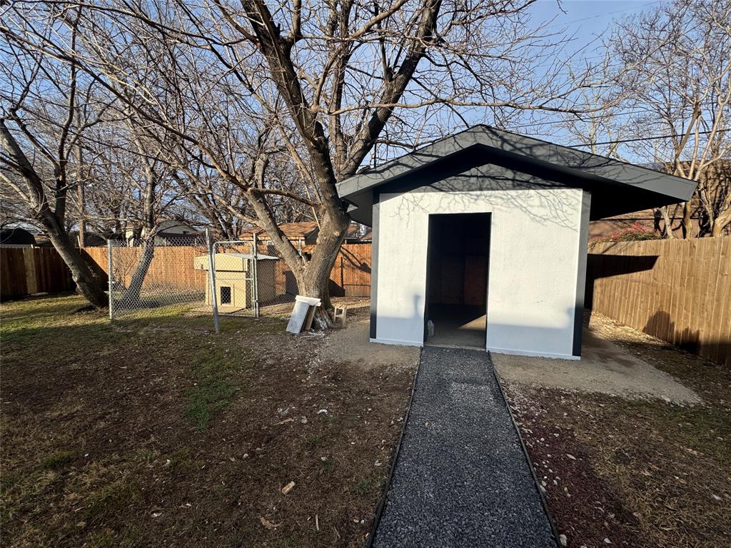 408 Steeple Ridge Road Everman, TX 76140 - Photo 13 of 14 a view of a house with a yard