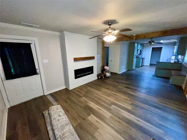 a view of livingroom with kitchen and furniture