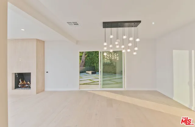 a view of a house with a small yard