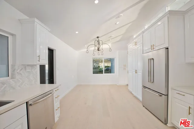 a view of a backyard of the house