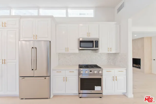 a view of a balcony with wooden floor and fence