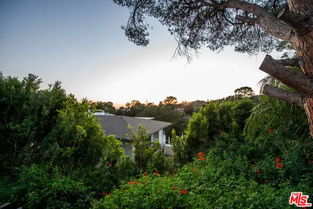 a view of a big room with windows and cabinet