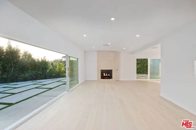 a bathroom with a double vanity sink a mirror and a shower