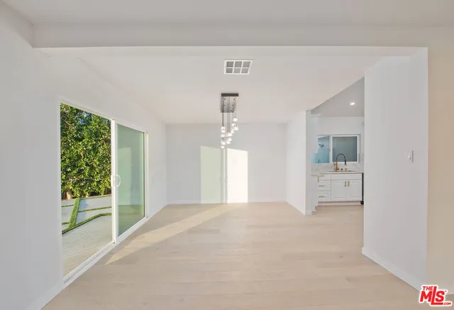 a bathroom with a shower and a mirror