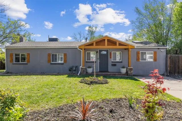 a front view of a house with yard