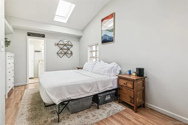 a bedroom with a bed and a table in it