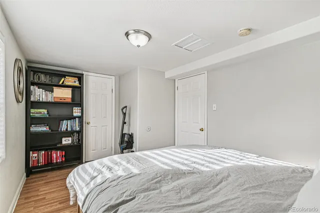 a bedroom with a bed and closet