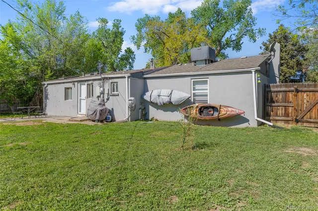 a view of a backyard with a garden and plants