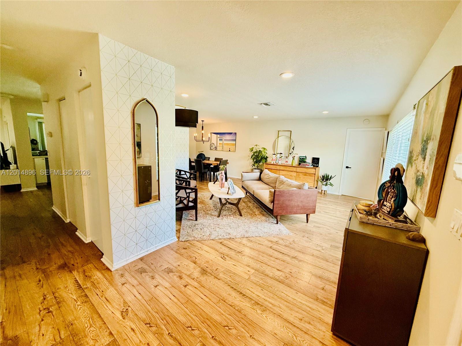 2411 Northwest 31st Street Boca Raton, FL 33431 - Photo 4 of 43 a bed room with a bed and a large mirror