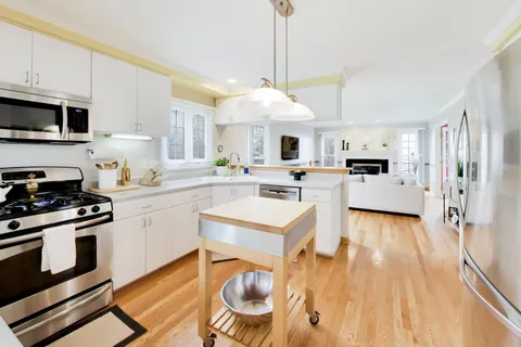 a kitchen with a stove a sink and a refrigerator