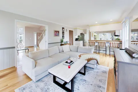 a living room with furniture and a table