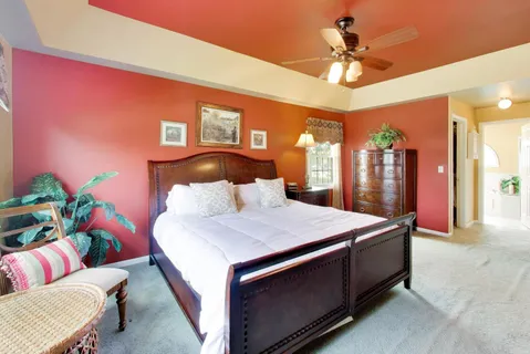 a bed room with a bed and a chandelier