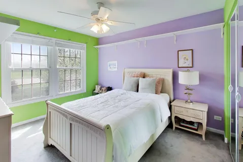 a bedroom with a bed and a table