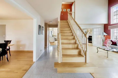 a view of entryway and hall with dining room