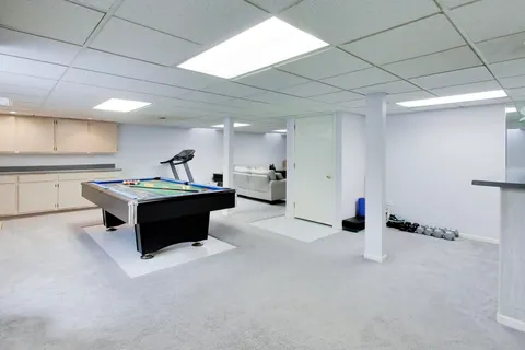 a kitchen with stainless steel appliances kitchen island sink stove and cabinets
