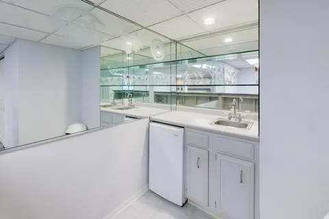 a kitchen with a sink and cabinets