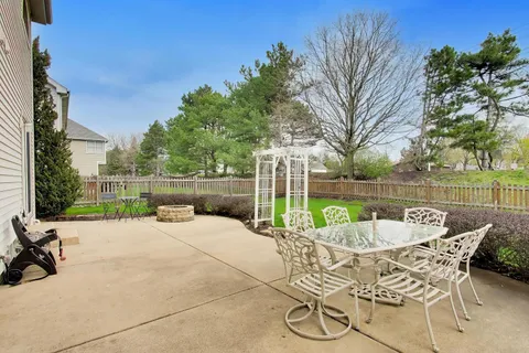a view of a patio with a yard