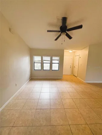 a view of an empty room with a window