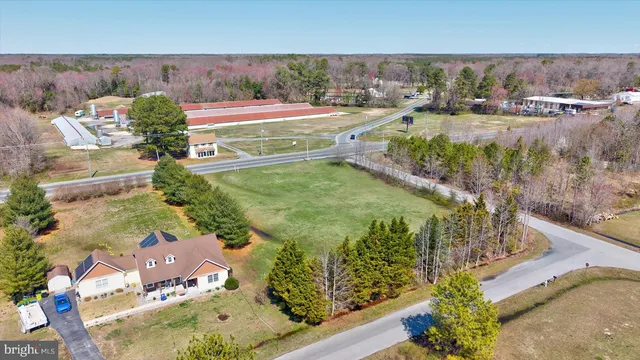 an aerial view of a residential houses with outdoor space