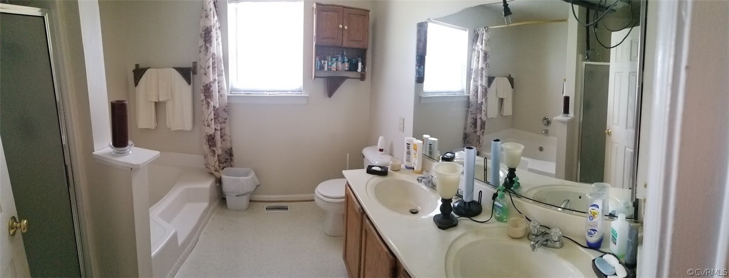 1224 Tree Ridge Road Henrico, VA 23231 - Photo 15 of 20 a bathroom with a sink a toilet and shower