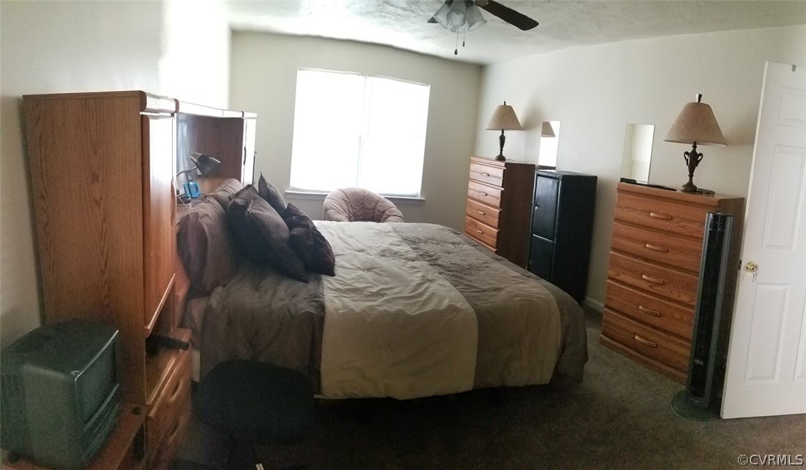 1224 Tree Ridge Road Henrico, VA 23231 - Photo 19 of 20 a bedroom with a bed and a dresser