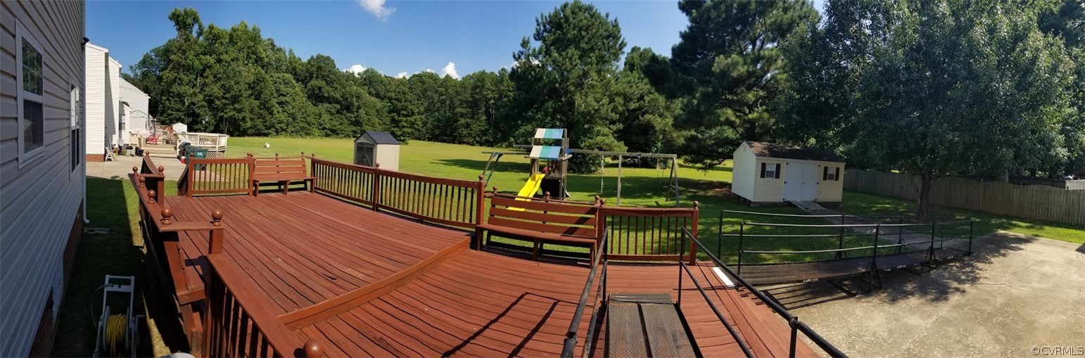 1224 Tree Ridge Road Henrico, VA 23231 - Photo 6 of 20 a view of a wooden deck and a yard with plants