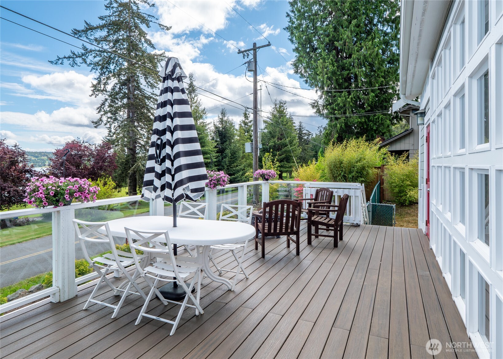 3530 West Sequim Bay Road Sequim, WA 98382 - Photo 17 of 40 a view of a patio with a table and chairs