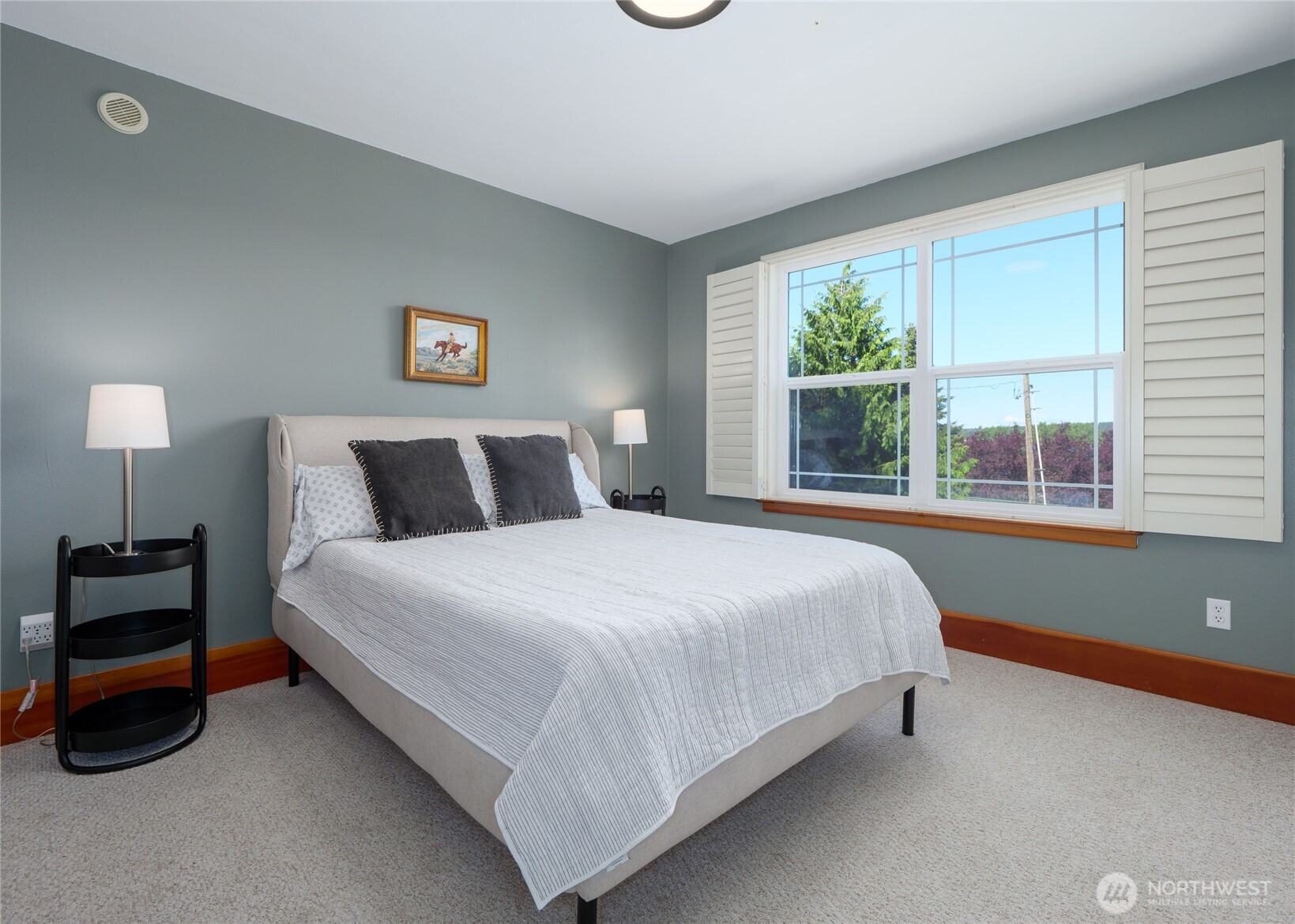3530 West Sequim Bay Road Sequim, WA 98382 - Photo 21 of 40 a bedroom with a bed and a window