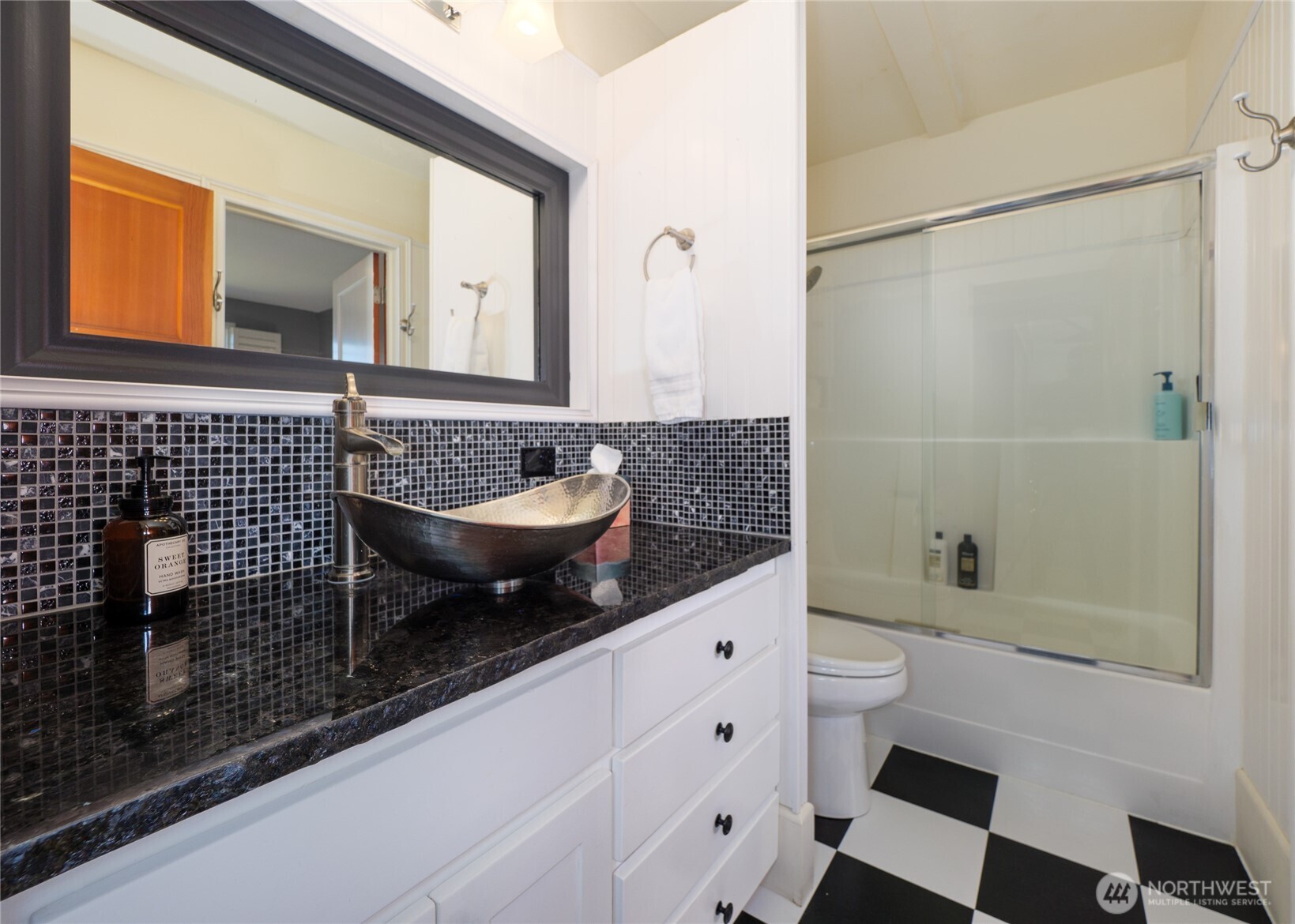 3530 West Sequim Bay Road Sequim, WA 98382 - Photo 22 of 40 a bathroom with a granite countertop sink a toilet and shower