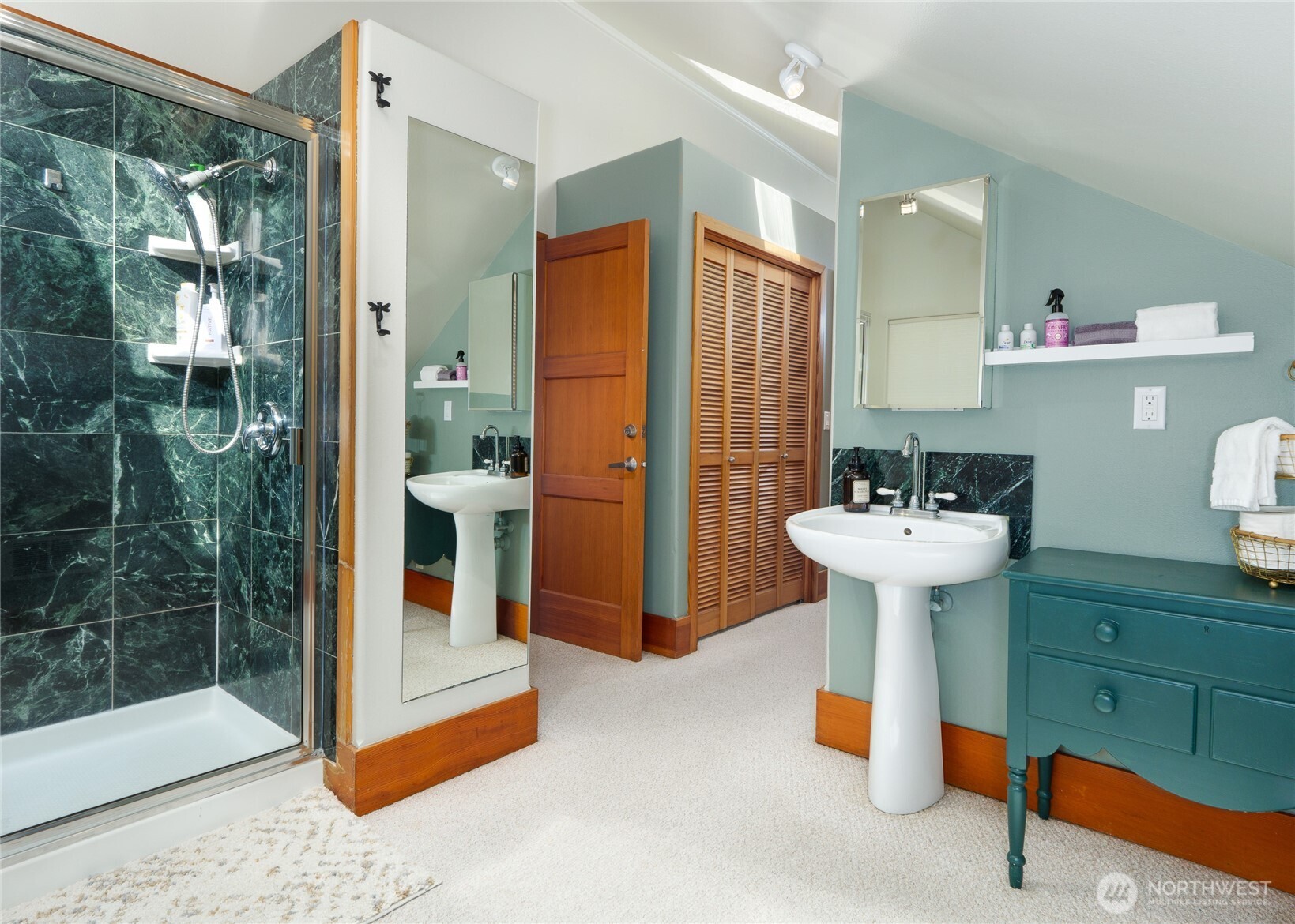 3530 West Sequim Bay Road Sequim, WA 98382 - Photo 23 of 40 a bathroom with a sink and mirror
