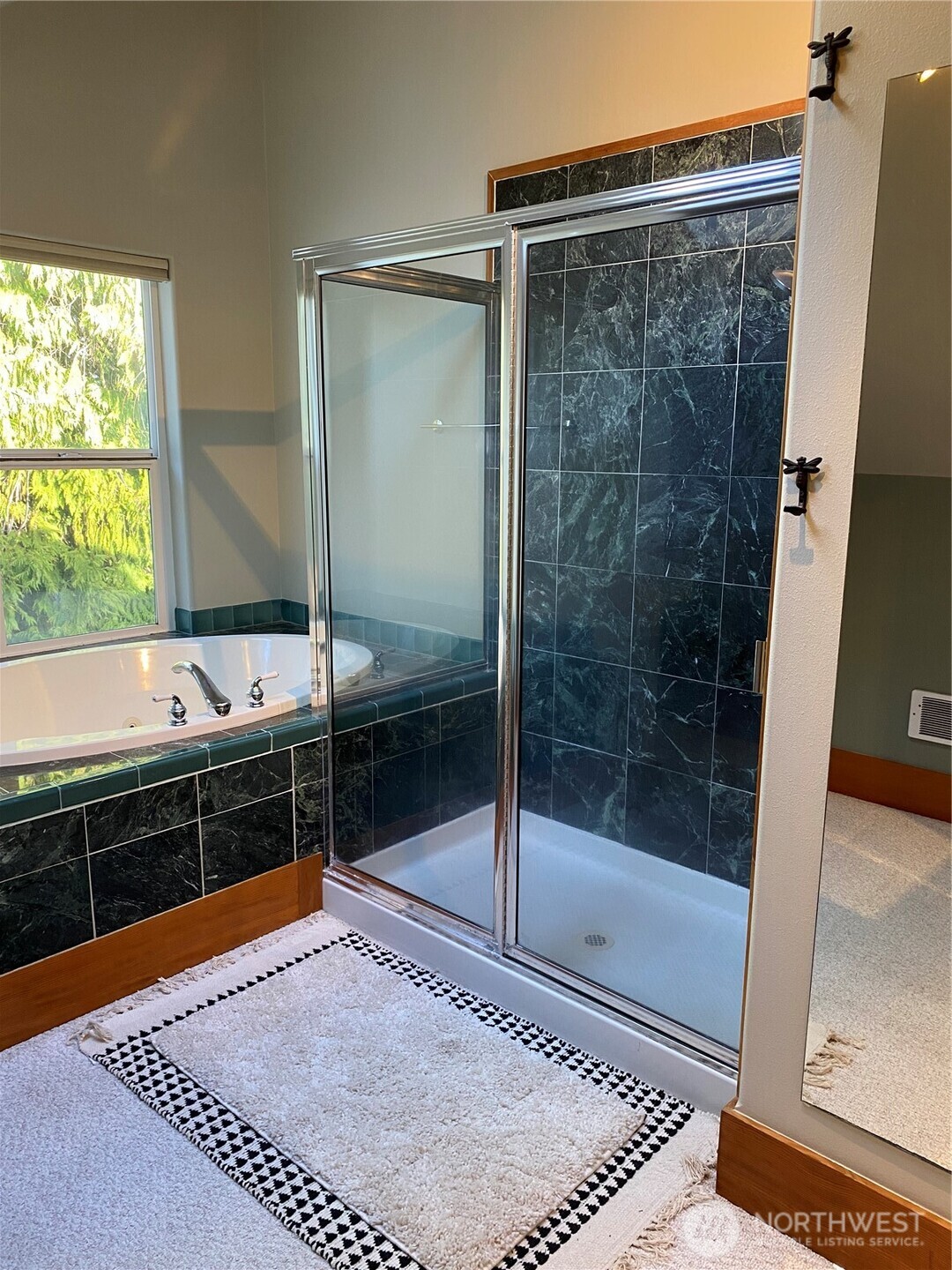 3530 West Sequim Bay Road Sequim, WA 98382 - Photo 24 of 40 a bathroom with a tub and shower