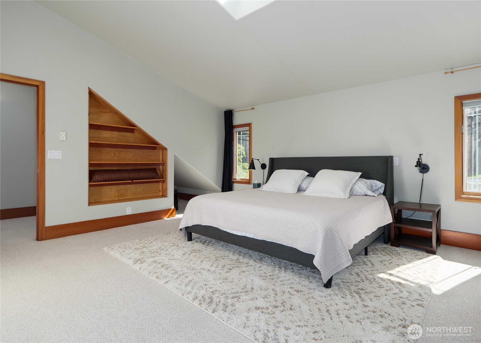 3530 West Sequim Bay Road Sequim, WA 98382 - Photo 25 of 40 a bedroom with a bed and wooden floor