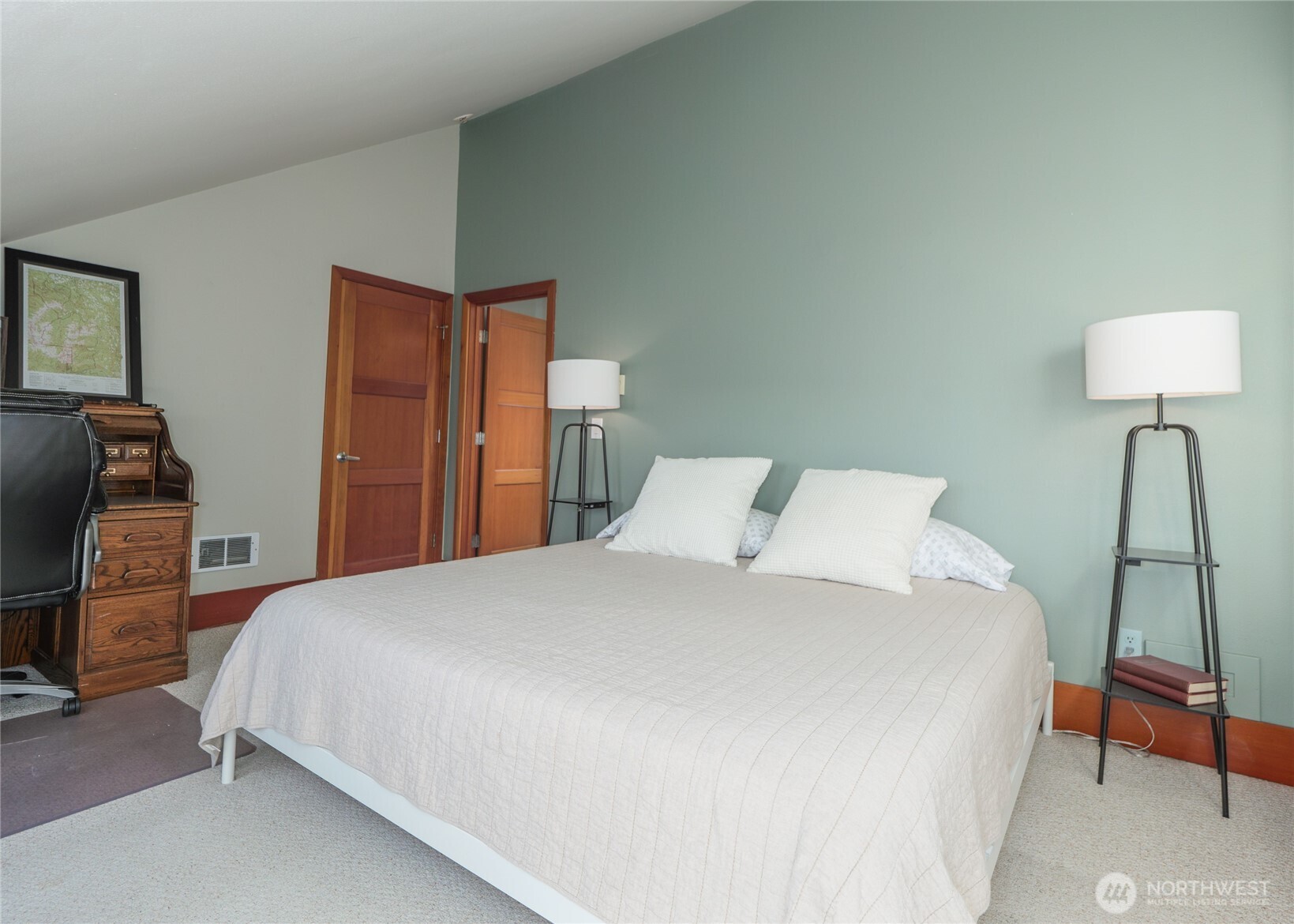 3530 West Sequim Bay Road Sequim, WA 98382 - Photo 26 of 40 a bedroom with a bed and a lamp