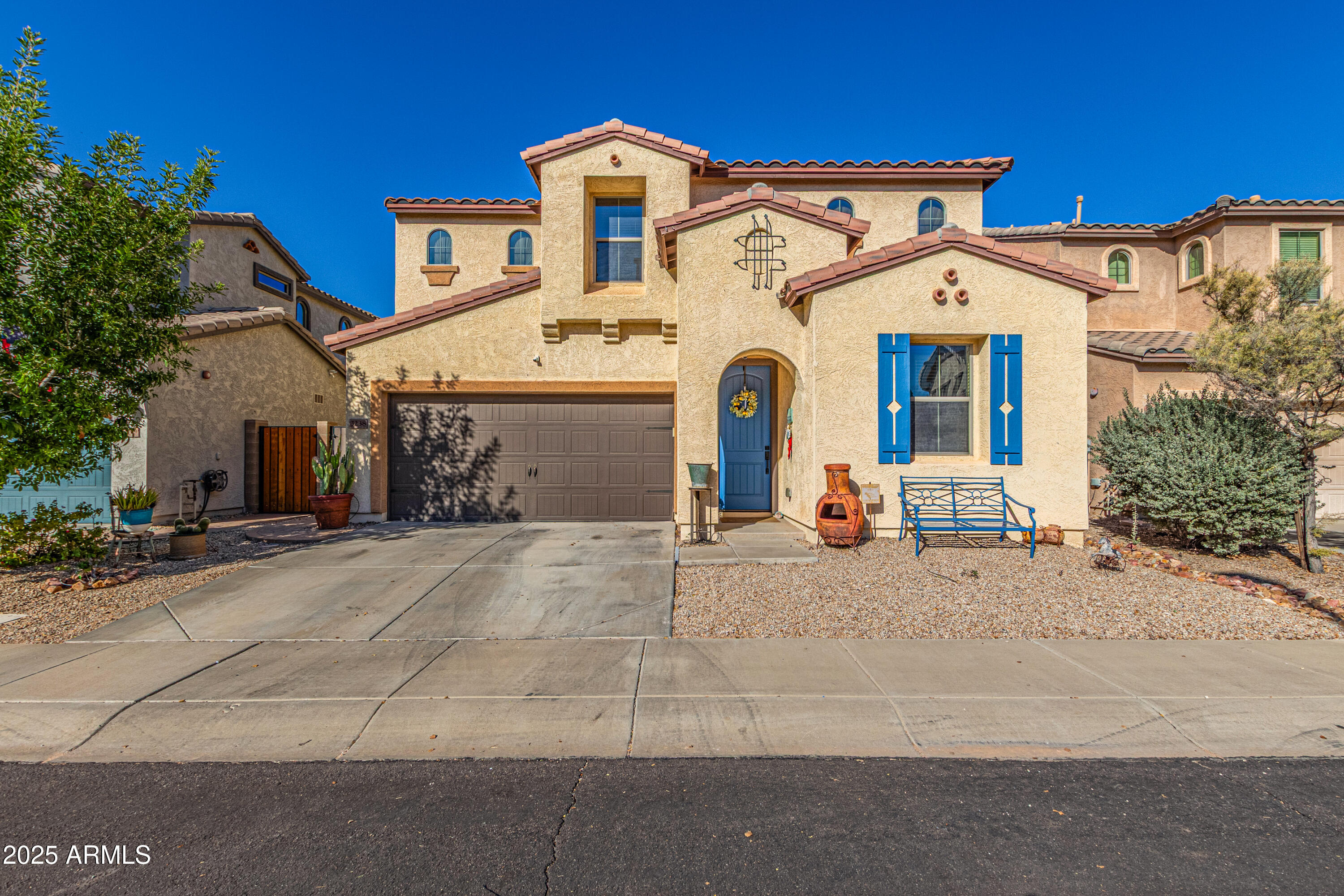 3238 East Ridgewood Lane Gilbert, AZ 85298 - Photo 1 of 43 a view of a white house with large windows and palm trees
