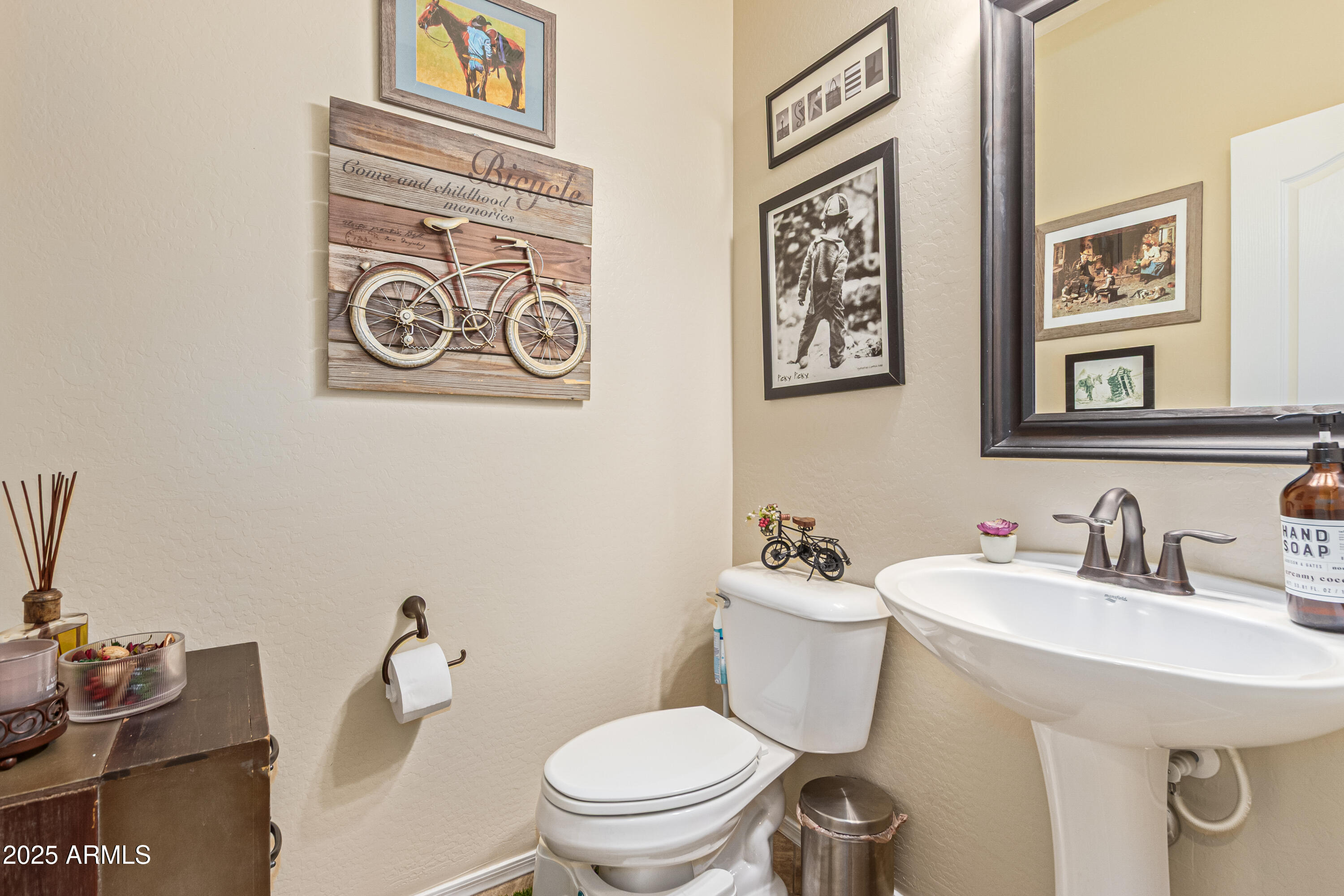 3238 East Ridgewood Lane Gilbert, AZ 85298 - Photo 13 of 43 a bathroom with a toilet a sink and mirror