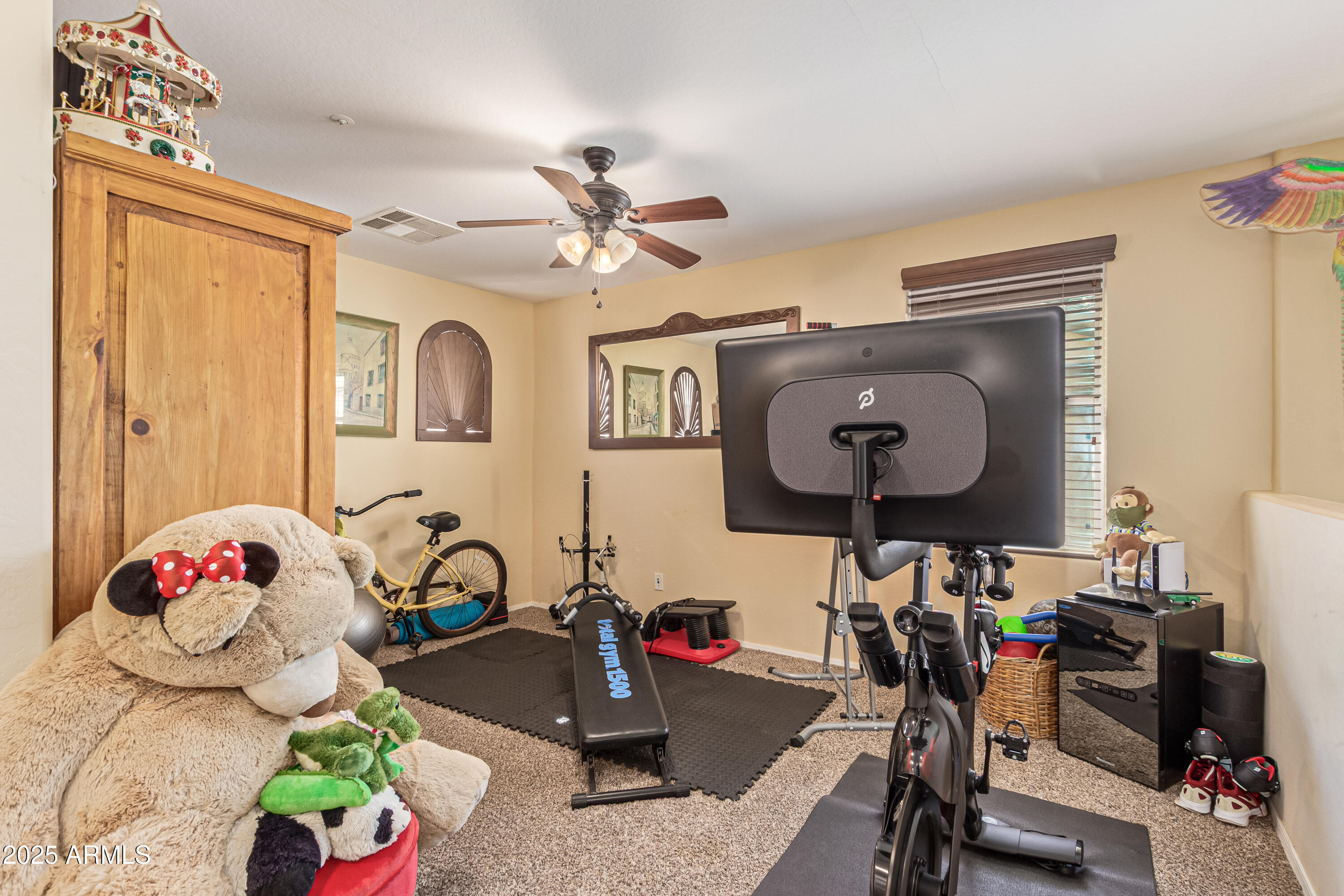 3238 East Ridgewood Lane Gilbert, AZ 85298 - Photo 14 of 43 a room with gym equipment and wooden floor