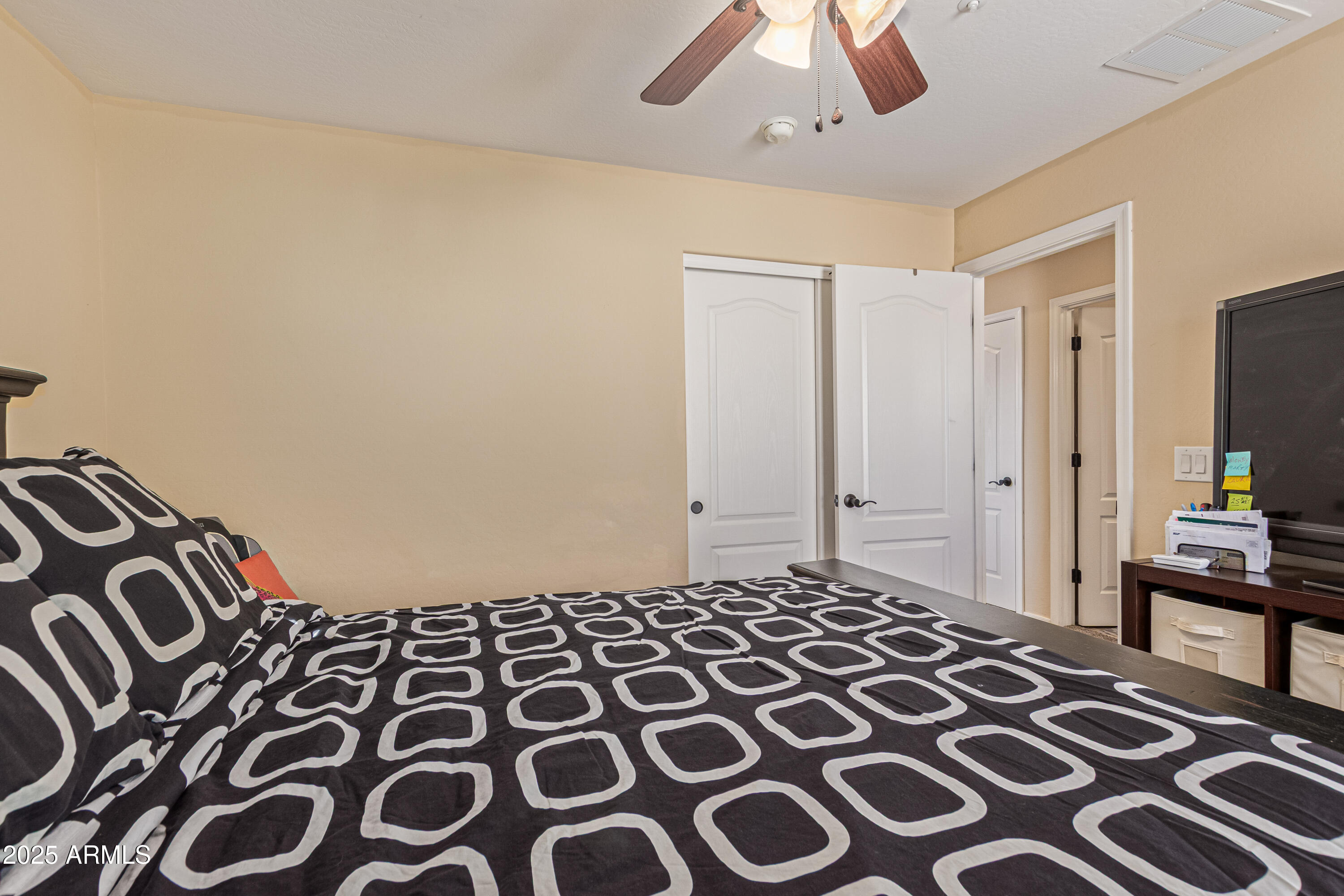 3238 East Ridgewood Lane Gilbert, AZ 85298 - Photo 23 of 43 a bedroom with a bed and a lamp