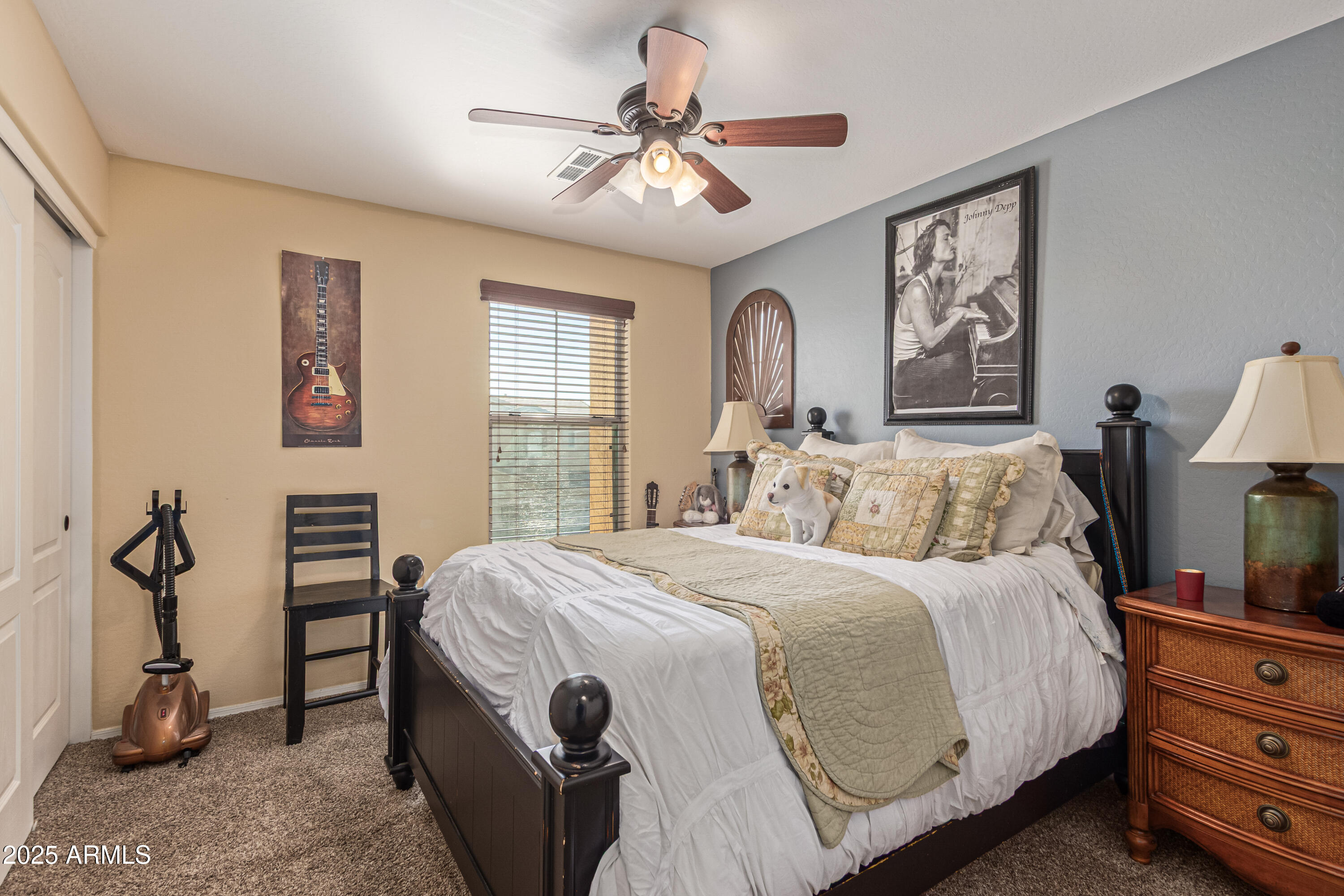 3238 East Ridgewood Lane Gilbert, AZ 85298 - Photo 26 of 43 a bedroom with a bed and a chandelier