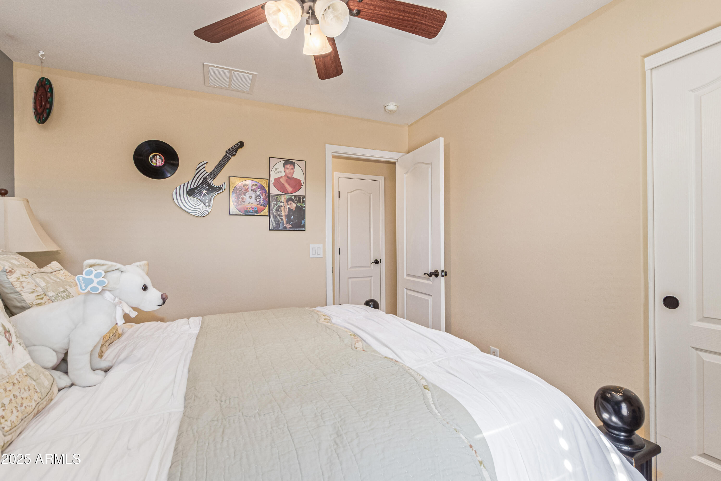 3238 East Ridgewood Lane Gilbert, AZ 85298 - Photo 27 of 43 a bedroom with a bed and a chandelier