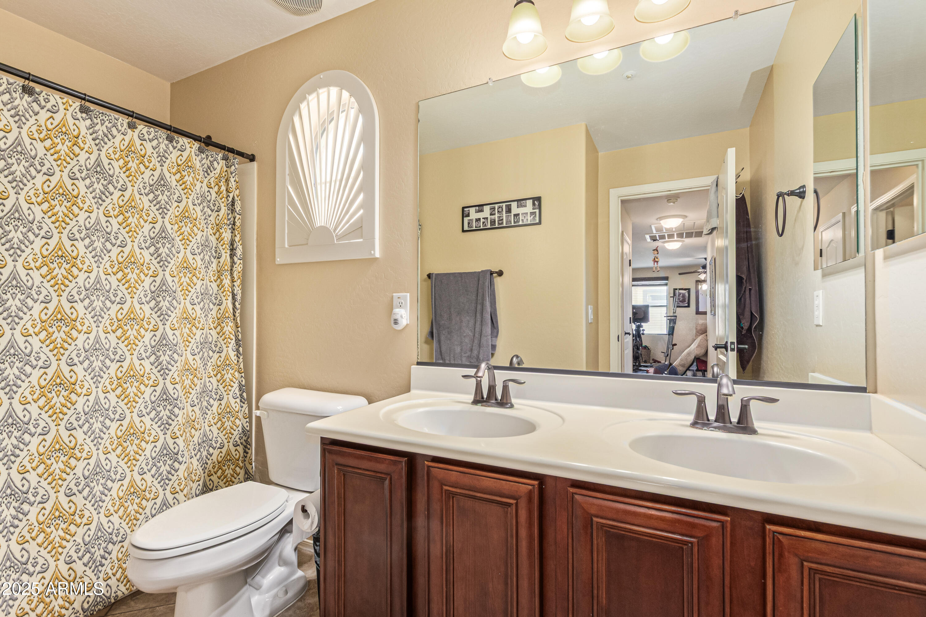 3238 East Ridgewood Lane Gilbert, AZ 85298 - Photo 28 of 43 a bathroom with a granite countertop toilet a sink and a mirror