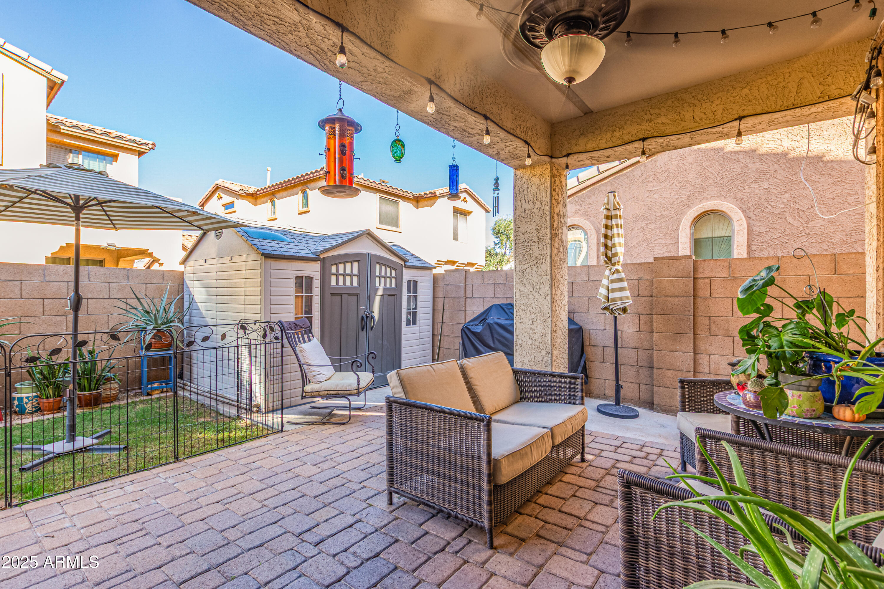 3238 East Ridgewood Lane Gilbert, AZ 85298 - Photo 31 of 43 a outdoor space with the couches and dining table and chairs