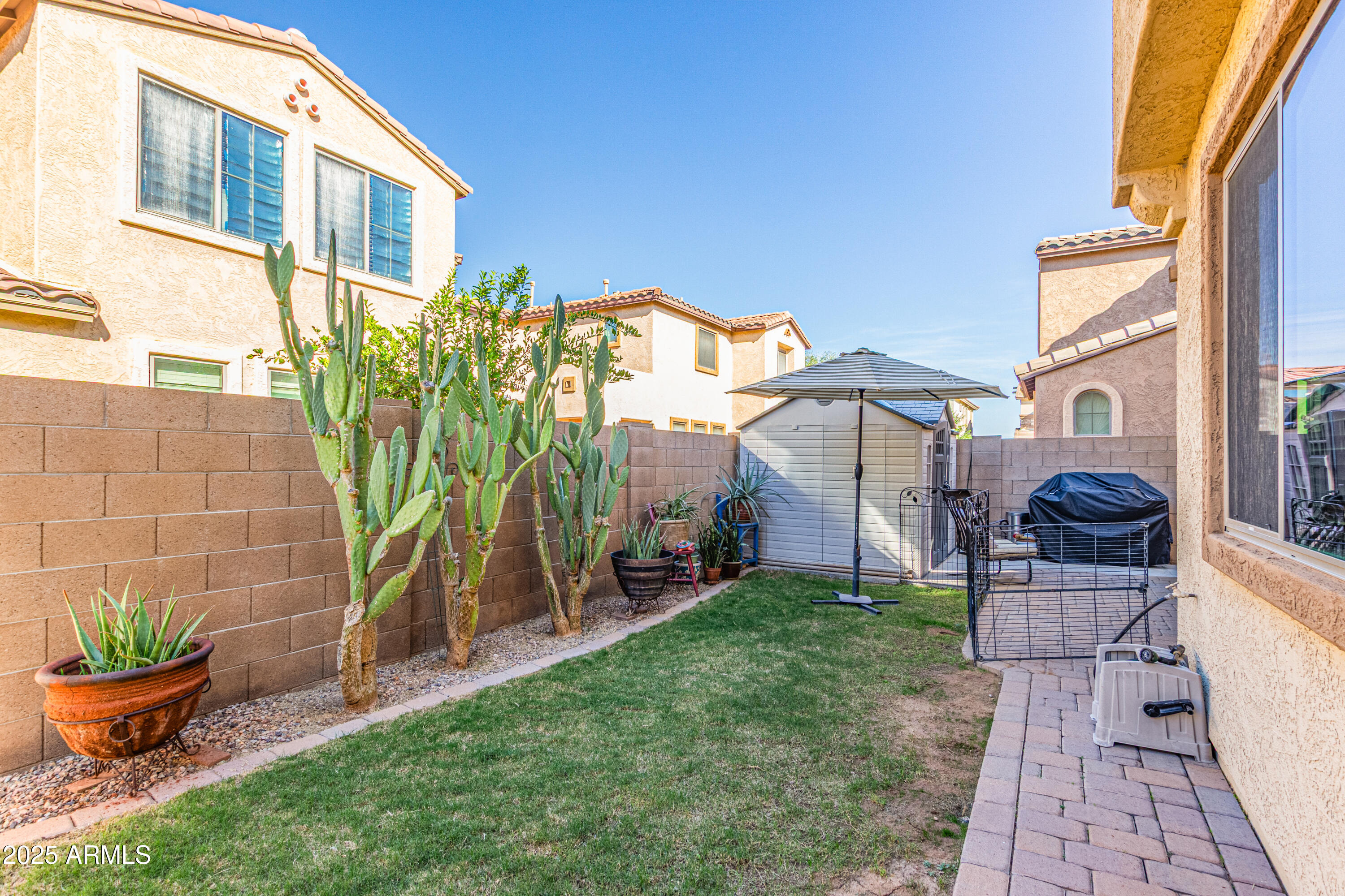 3238 East Ridgewood Lane Gilbert, AZ 85298 - Photo 33 of 43 a front view of a house with garden