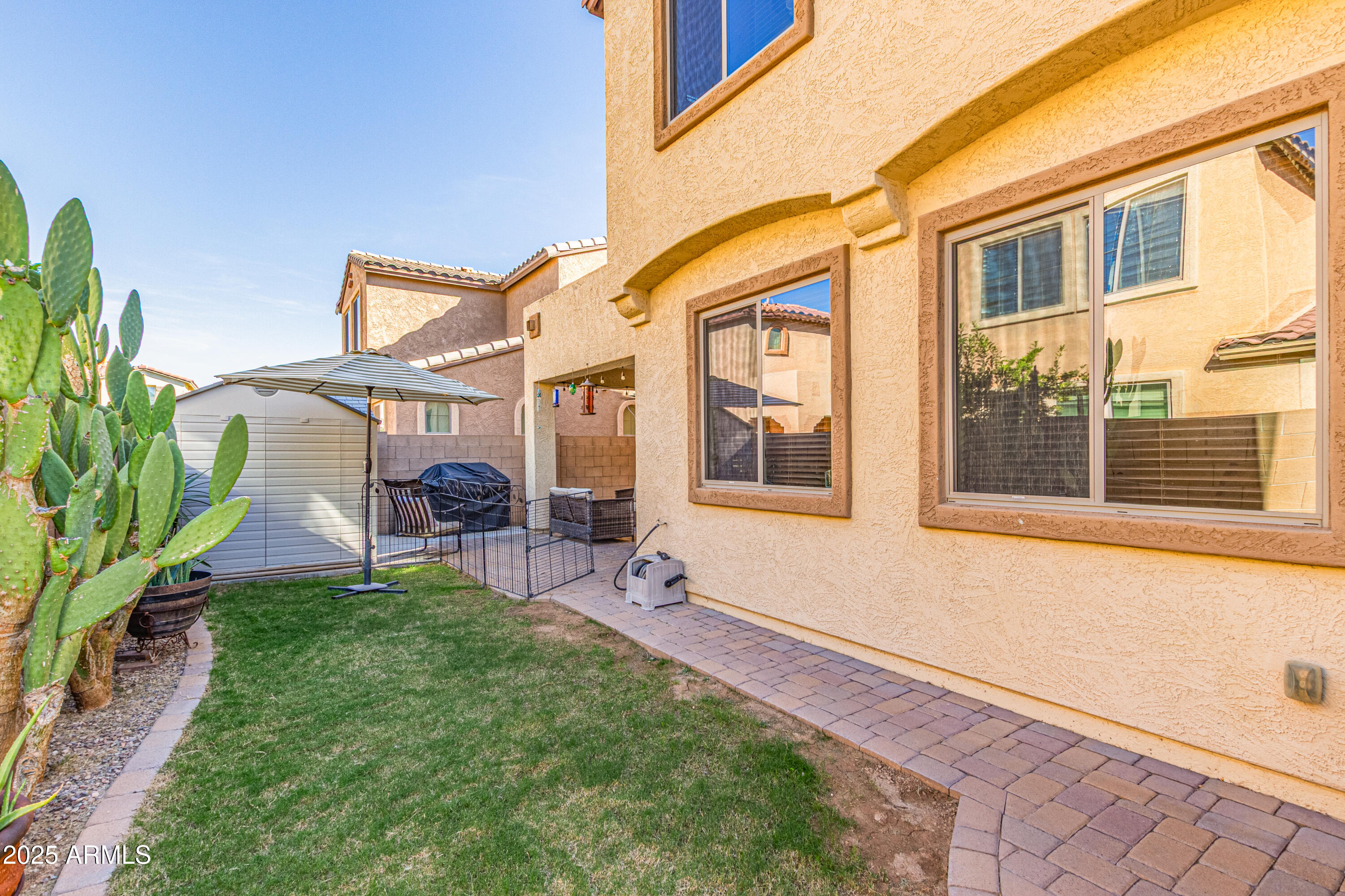 3238 East Ridgewood Lane Gilbert, AZ 85298 - Photo 34 of 43 a view of a house with a backyard