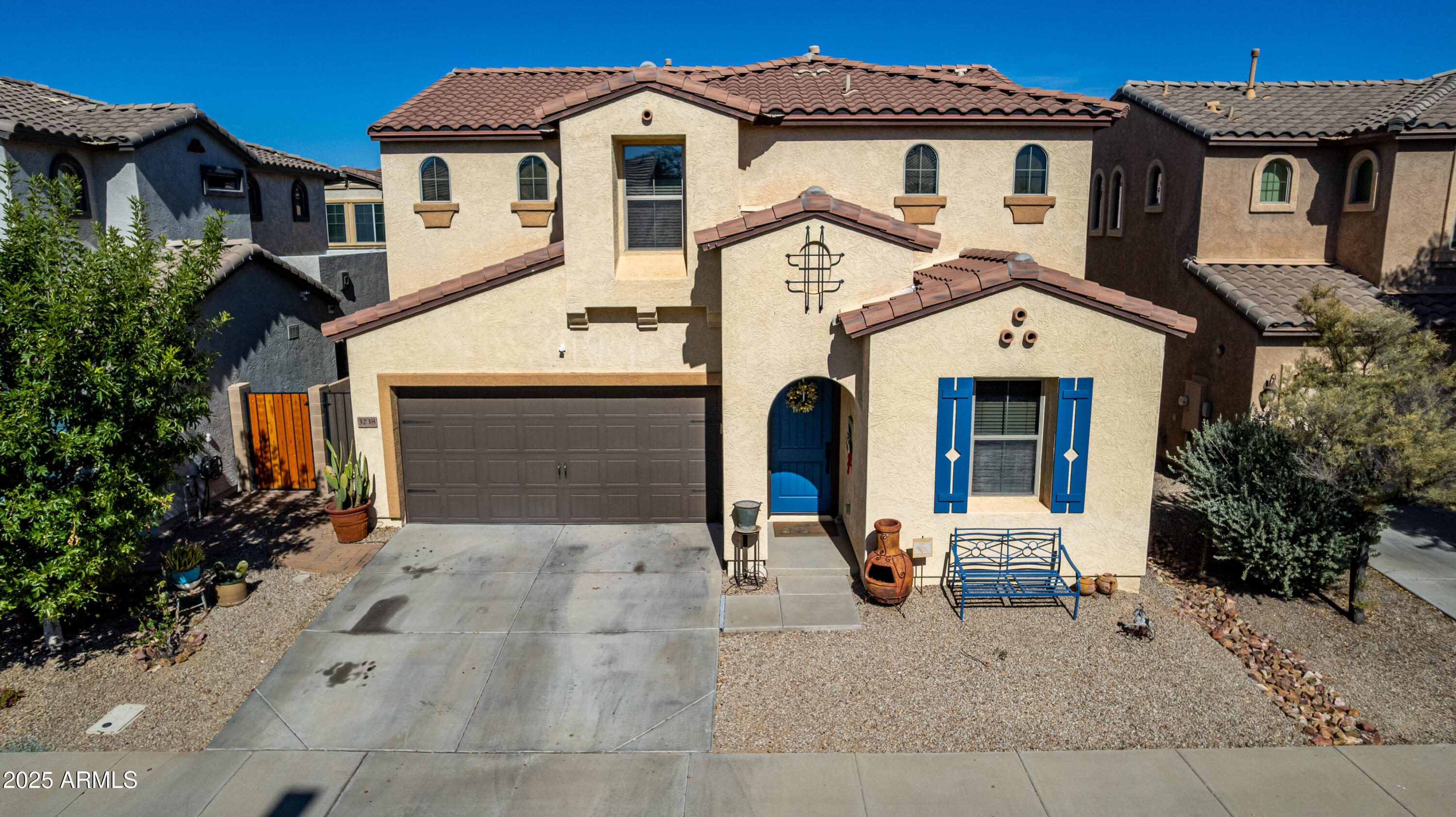 3238 East Ridgewood Lane Gilbert, AZ 85298 - Photo 36 of 43 a front view of a house with garden