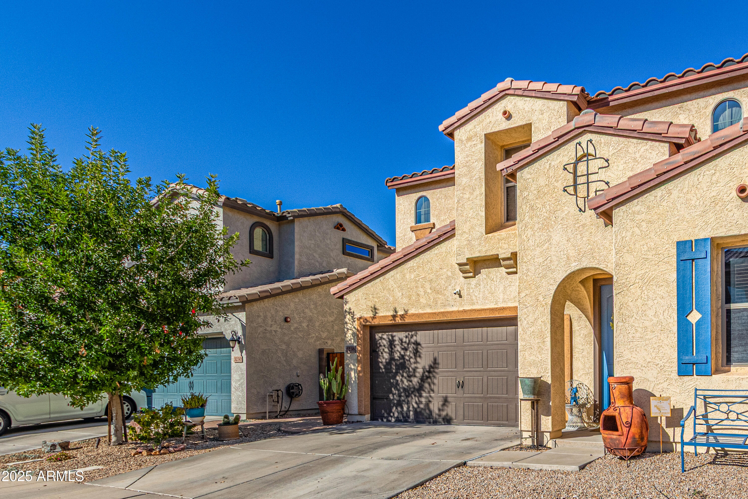 3238 East Ridgewood Lane Gilbert, AZ 85298 - Photo 5 of 43 a front view of a house with a garage